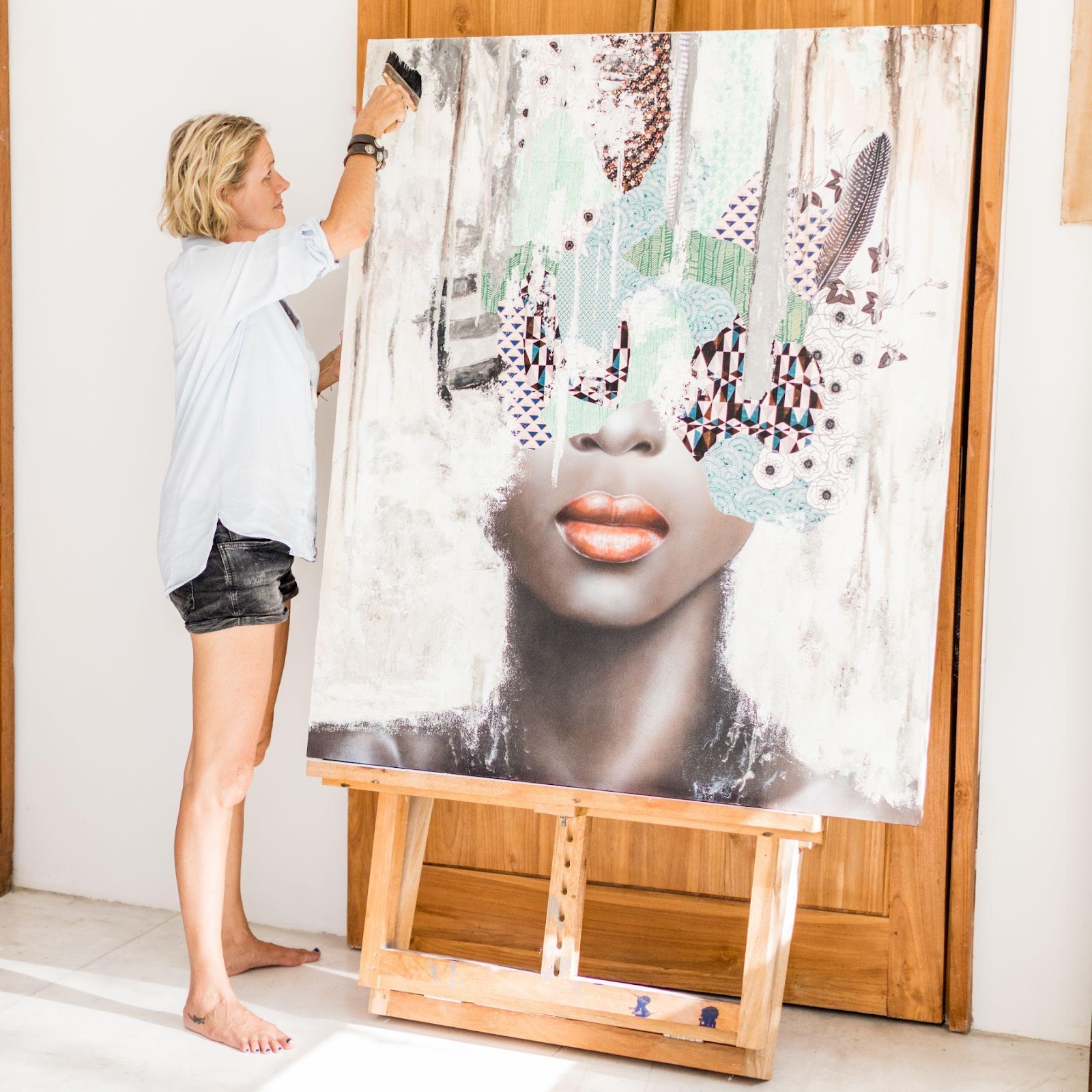 Irene Hoff works on a large portrait